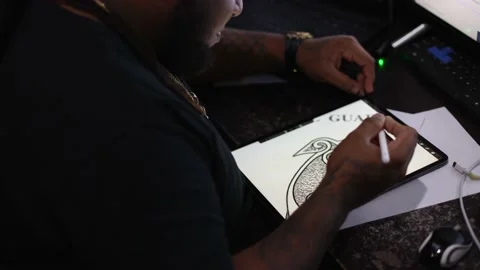 Man drawing a dog on a tablet. Side view. Stock Footage 169521770