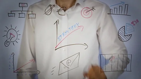 Man drawing growth chart and writing strategy on transparent screen Stock Footage 81637363