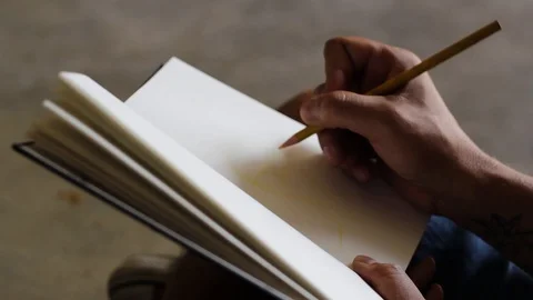 Man Drawing Guidelines on Sketchbook 스톡 동영상 112835197