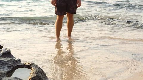 Man Drawing Heart Shape in Sand of Tropical Beach for Girlfriend Stock Footage 126088981