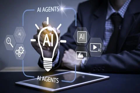 A man is drawing a light bulb on a tablet with the words AI Agents Stock Photos