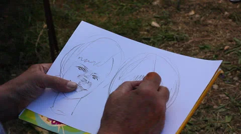 Man drawing portrait Stock Footage 27114034