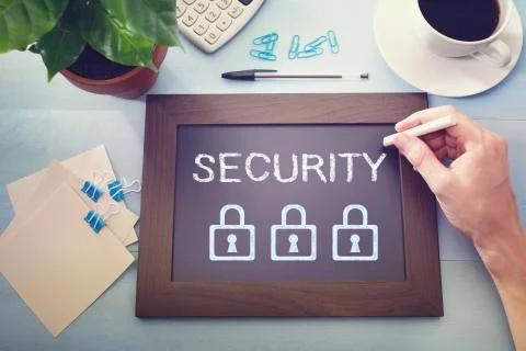 Man drawing security concept on chalkboard 写真素材