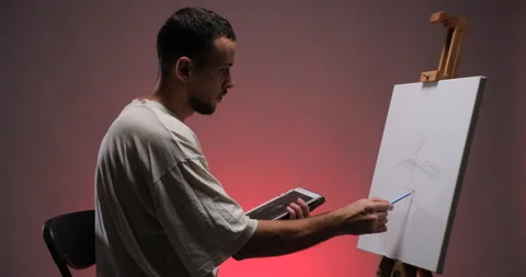 Man drawing sketch on canvas from tablet pc Stock Footage 233906123