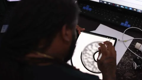 Man drawing something on a tablet. Rear view. Stock Footage 168635226
