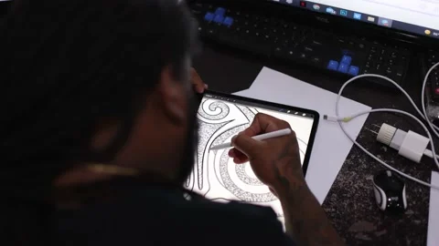 Man drawing something on a tablet. Rear view. Video stock 171879769