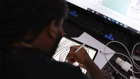 Man drawing on a tablet. Rear view. Stock Footage 183989911