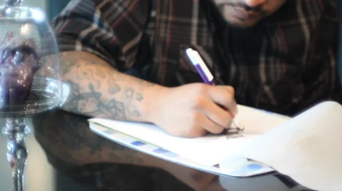Man drawing a tattoo Stock Footage 28295283