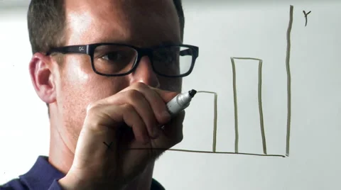 Man Draws a Bar Graph on a Pane of Glass Stock Footage 61479950