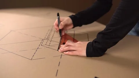Man draws broken lines with a marker on a ruler. Stock Footage 143252696