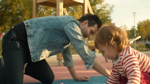 Man draws with chalks on the playground Video stock 112401640