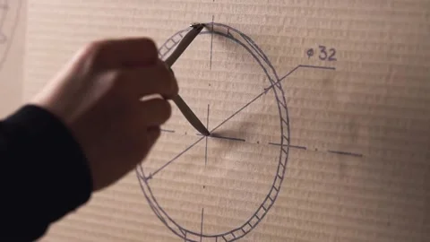 Man draws a circle with a compass on a drawing. Stock Footage 143546942