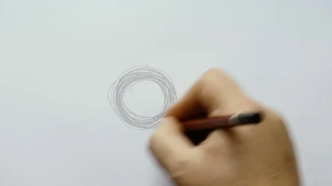 Man draws a circle with a pencil Stock Footage 80719115