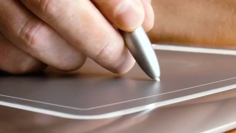Man draws on a graphic tablet for drawing Stock Footage 78914327