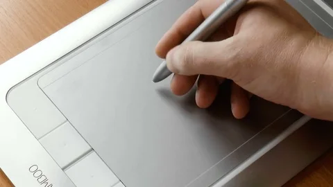 Man draws on a graphic tablet for drawing Stock Footage 79100074
