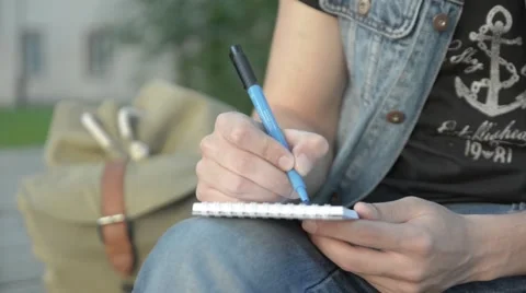 A man draws in a notebook. Stock Footage 51755699