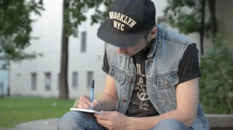 A man draws in a notebook. Stock Footage 51755737