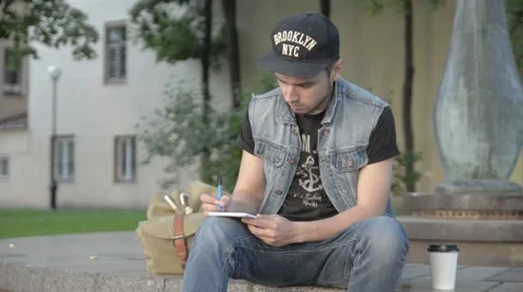 A man draws in a notebook. Stock Footage 51755753