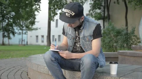 A man draws in a notebook. Stock Footage 51755774