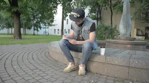 A man draws in a notebook. Stock Footage 51755842