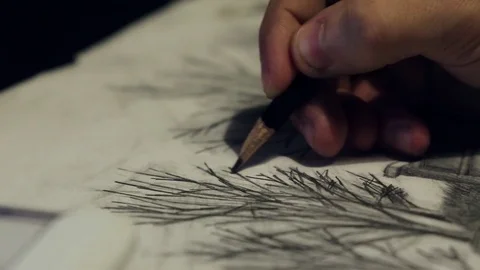 A man draws with a pencil Stockbeeldmateriaal 82742053