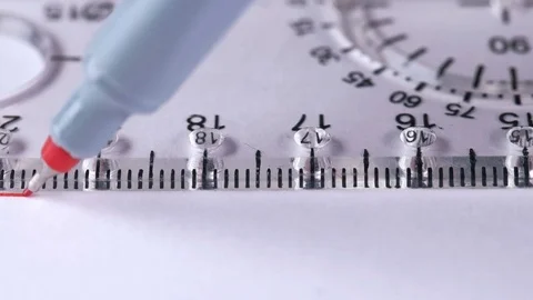 The man draws a straight line with a ruler on a white sheet Stock Footage 83226813