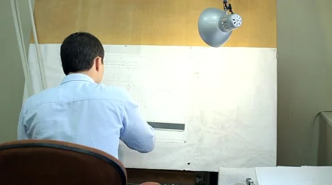Man Draws a Technical Drawing on Drawing Board Stock Footage 50450832