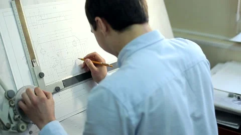 Man Draws a Technical Drawing on Drawing Board Stock Footage 50450833