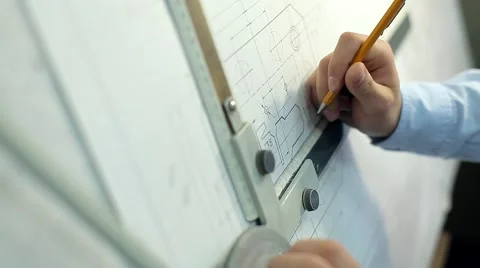 Man Draws a Technical Drawing on Drawing Board Stock Footage 50450838