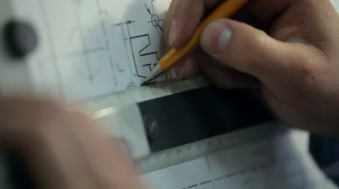 Man Draws a Technical Drawing on Drawing Board Stock Footage 50450857