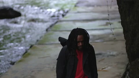 A Man With Dreadlocks Climbing up the Stair With Close up Looks Stock Footage 208055093