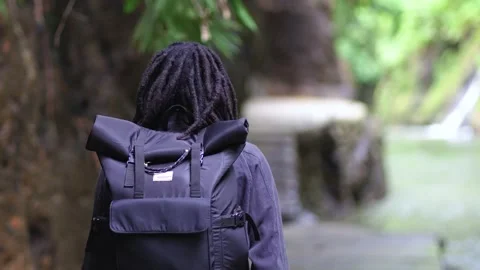 A Man With Dreadlocks Doing Small Walk Near a River Stock Footage 207663355