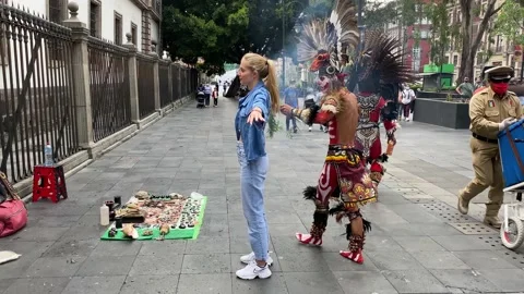 Man dressed in Aztec costume performs rituals in Mexico City, Mexico 4K Stock Footage 161368763