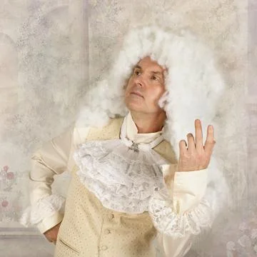 Man dressed in baroque style clothes in the studio Stockfoto's