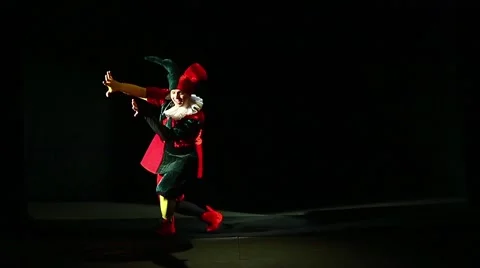 a man dressed in a jester costume is pla... | Stock Video | Pond5