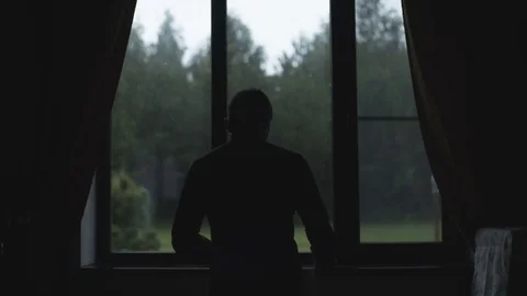 Man Dresses Near Window Stock Footage 78013533
