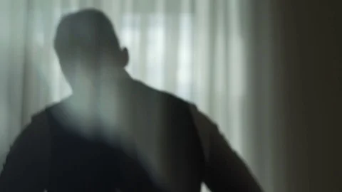 Man Dresses Near Window Vídeo Stock 78228376
