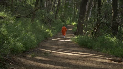 Man Dressing as a Monk walking Stock Footage 129901876