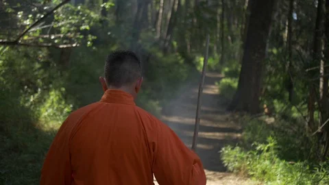 Man Dressing as a Monk walking Stock Footage 129906756