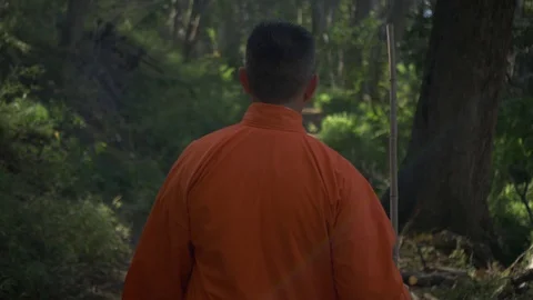 Man Dressing as a Monk walking Stock Footage 129906770