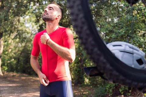 Man dressing next to his van to go cycling Stock Photos