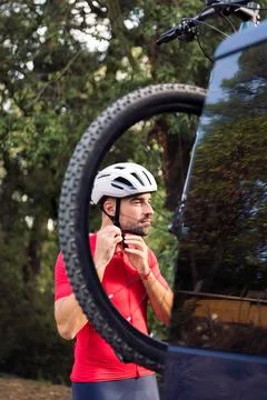 Man dressing next to his van to go cycling Stock Photos