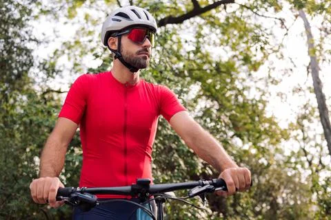 Man dressing next to his van to go cycling Stock Photos