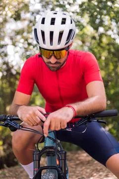 Man dressing next to his van to go cycling Stock Photos