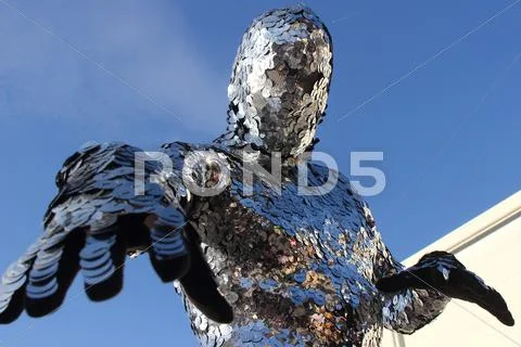 Man dressing shiny metallic discs Stock Photos