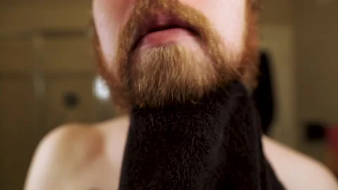 Man Dries Beard and uses Comb. Facial hair care and hygiene. Stock Footage 139992465