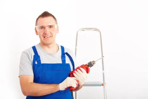 Man with drill Stock Photos