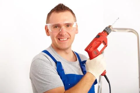 Man with drill Stock Photos