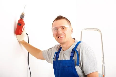 Man with drill Stock Photos