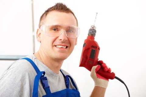 Man with drill Stock Photos